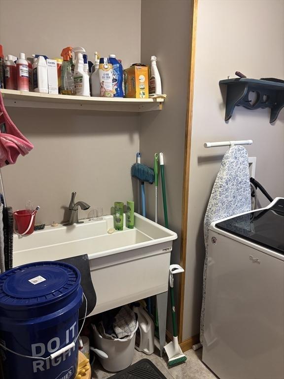 laundry room featuring washer / clothes dryer and laundry area