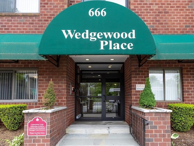 666 Main St Unit 206, Winchester, MA 01890 - property entrance with brick siding and french doors