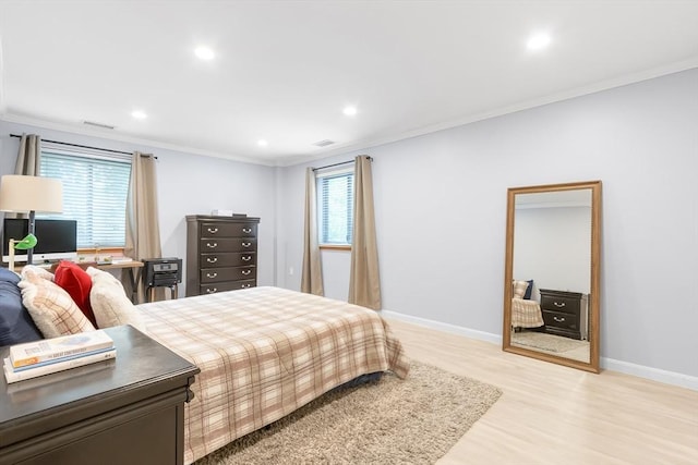 666 Main St Unit 206, Winchester, MA 01890 - bedroom featuring light wood finished floors, crown molding, multiple windows, recessed lighting, and baseboards