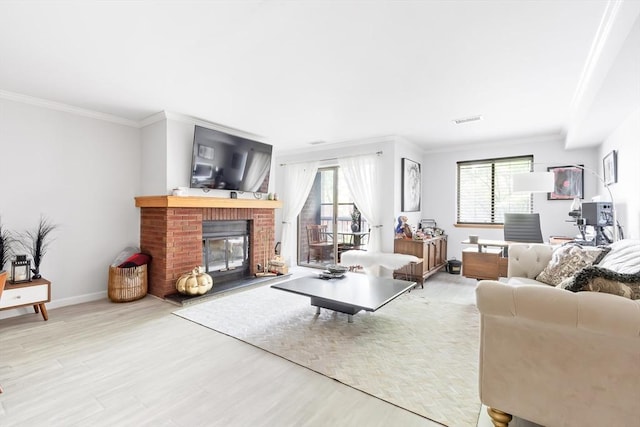 666 Main St Unit 206, Winchester, MA 01890 - living room featuring wood finished floors, ornamental molding, plenty of natural light, and a brick fireplace