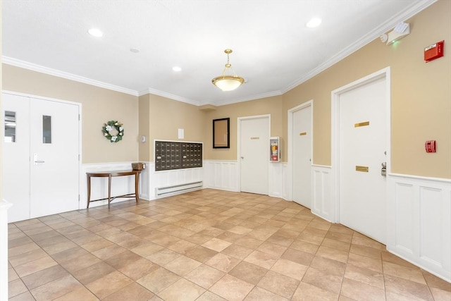 666 Main St Unit 206, Winchester, MA 01890 - spare room featuring baseboard heating, a wainscoted wall, crown molding, recessed lighting, and a decorative wall