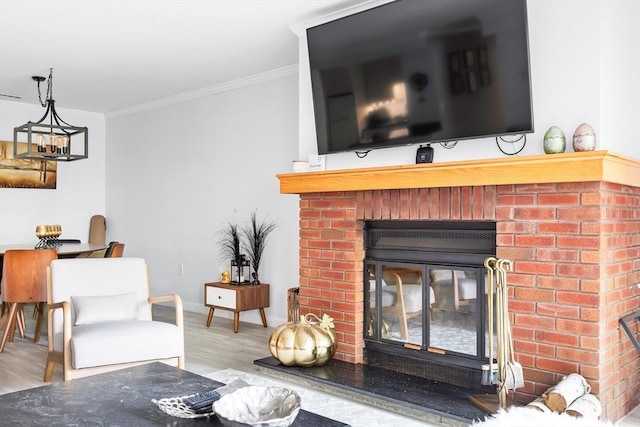 666 Main St Unit 206, Winchester, MA 01890 - living room with crown molding, wood finished floors, baseboards, and a brick fireplace