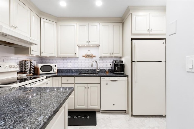666 Main St Unit 206, Winchester, MA 01890 - kitchen with white appliances, a sink, light marble finish flooring, under cabinet range hood, and dark stone countertops