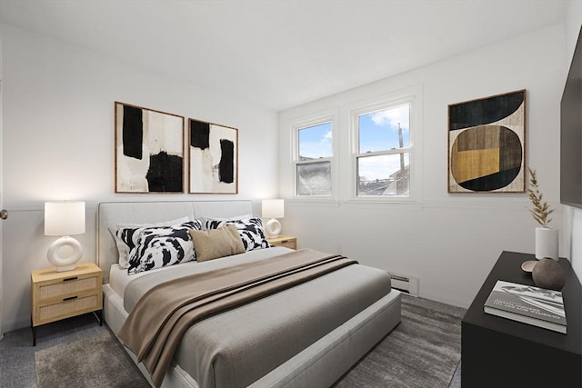 carpeted bedroom featuring a baseboard radiator