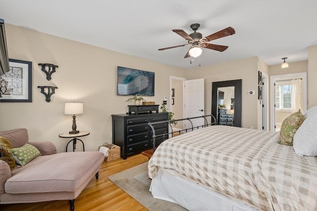 bedroom with wood finished floors and a ceiling fan