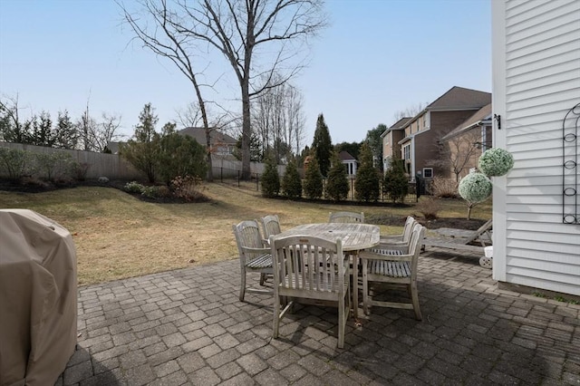 view of patio / terrace with outdoor dining area, a fenced backyard, and grilling area