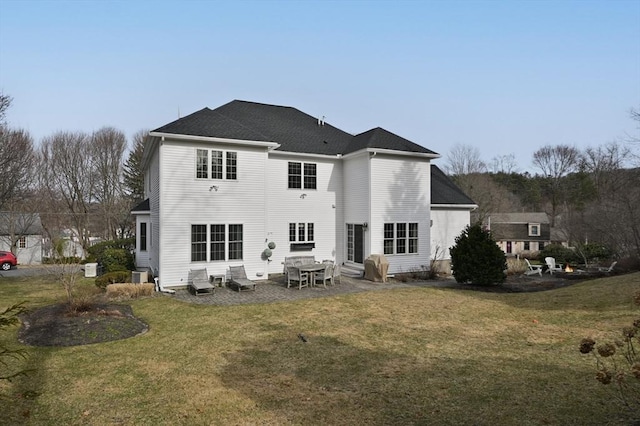 rear view of house featuring cooling unit, a lawn, and entry steps