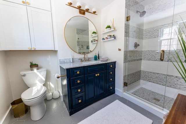 full bathroom featuring tile patterned flooring, toilet, a shower stall, and vanity