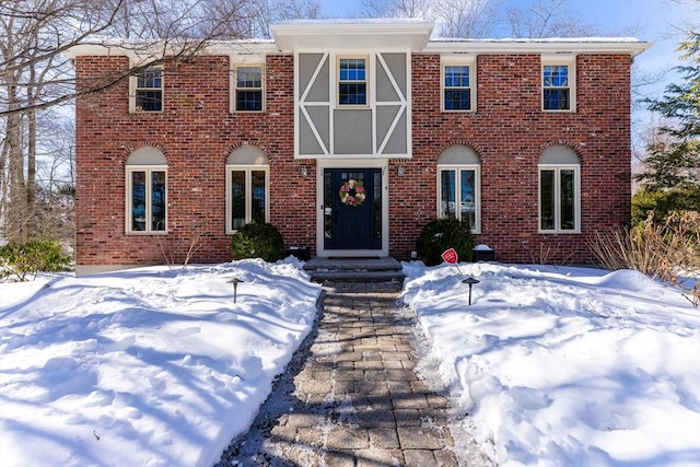 view of front of house with brick siding