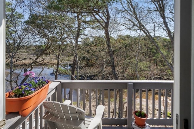 wooden deck featuring a water view