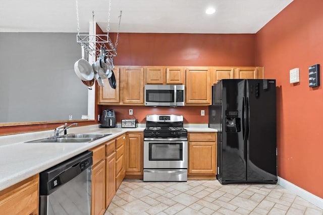 1185 Read St, Somerset, MA 02726 - kitchen featuring appliances with stainless steel finishes, a sink, and light countertops