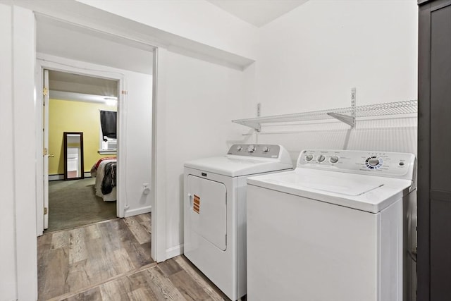 1185 Read St, Somerset, MA 02726 - washroom featuring independent washer and dryer, light wood-style floors, and baseboard heating