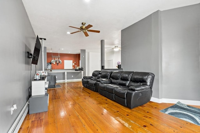 1185 Read St, Somerset, MA 02726 - living area featuring baseboard heating, a ceiling fan, baseboards, and hardwood / wood-style flooring