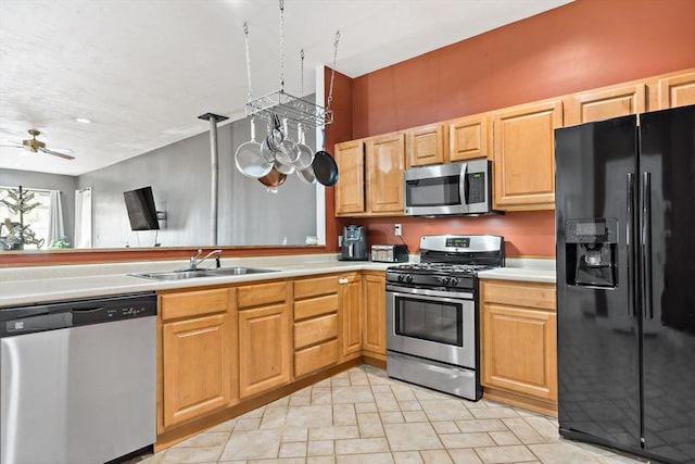 1185 Read St, Somerset, MA 02726 - kitchen featuring appliances with stainless steel finishes, a sink, light countertops, and a ceiling fan