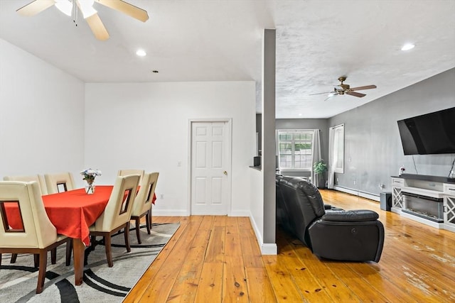 1185 Read St, Somerset, MA 02726 - dining space featuring a ceiling fan, a baseboard heating unit, wood-type flooring, baseboards, and recessed lighting