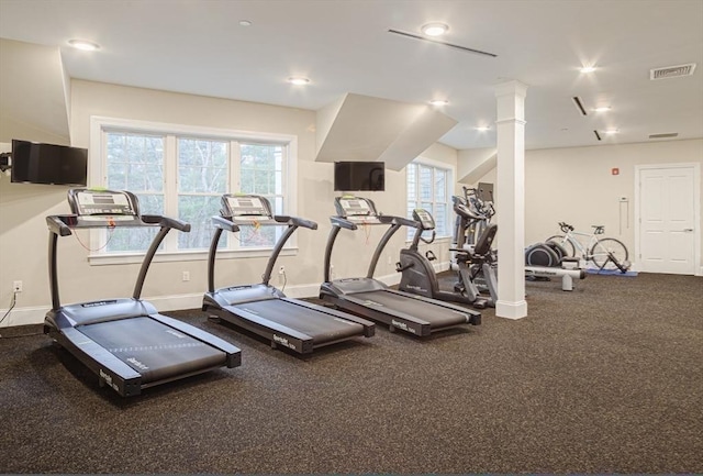 exercise room featuring visible vents and baseboards