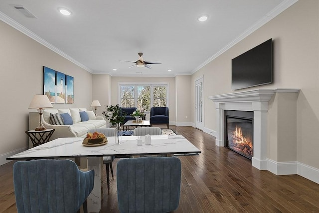 living area with visible vents, recessed lighting, and dark wood-style floors