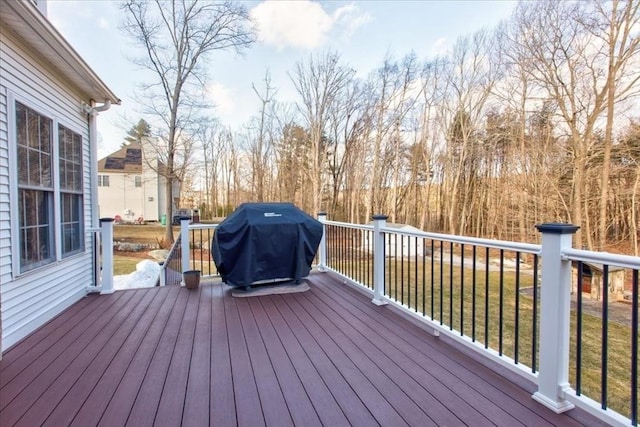 wooden terrace featuring a grill