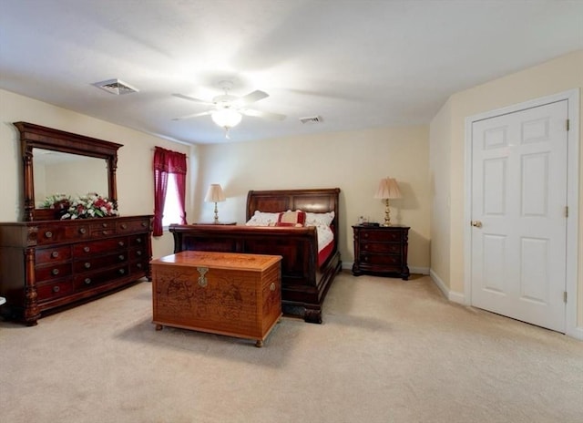 bedroom featuring visible vents, baseboards, ceiling fan, and carpet flooring