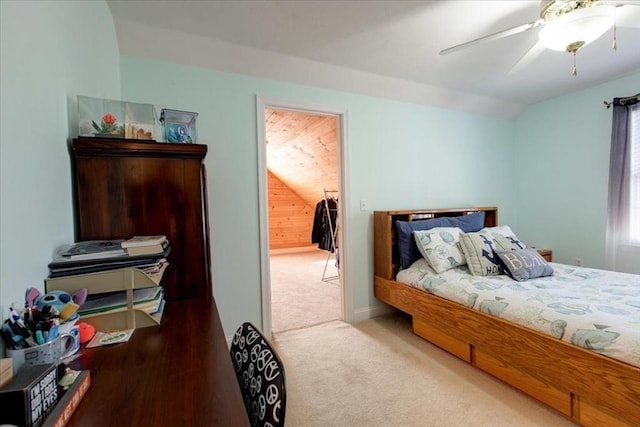 bedroom featuring vaulted ceiling, carpet flooring, and a ceiling fan