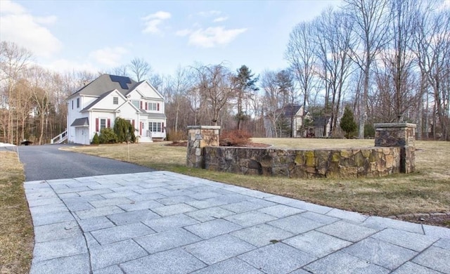 view of street with aphalt driveway