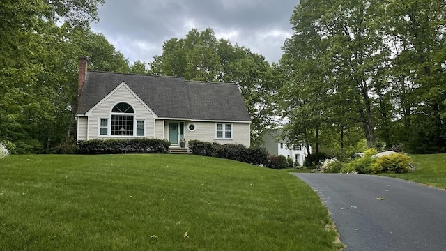 93 Mccracken Rd, Millbury, MA 01527 - view of front of home with a chimney and a front lawn