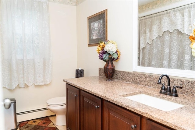 93 Mccracken Rd, Millbury, MA 01527 - full bathroom featuring a baseboard radiator, vanity, and toilet