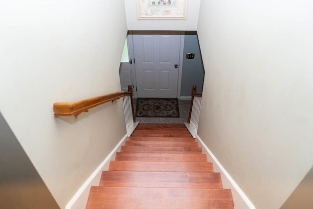 93 Mccracken Rd, Millbury, MA 01527 - staircase featuring wood finished floors and baseboards
