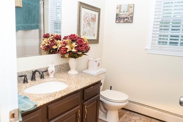 93 Mccracken Rd, Millbury, MA 01527 - bathroom with baseboard heating, vanity, and toilet