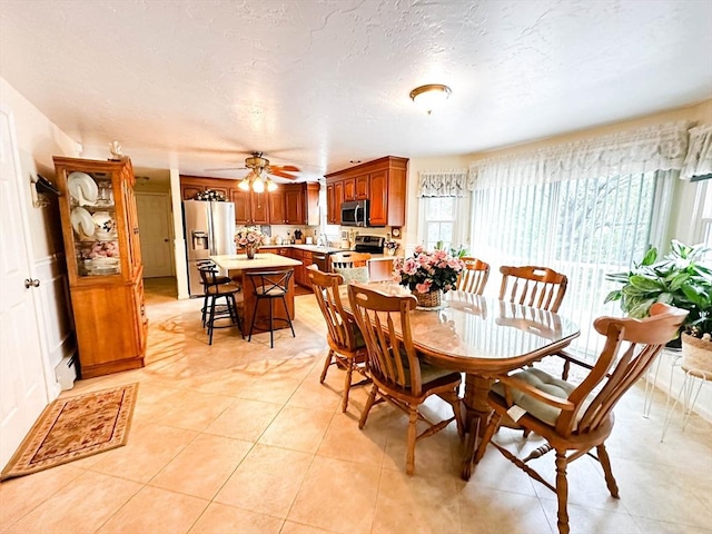 93 Mccracken Rd, Millbury, MA 01527 - dining area featuring ceiling fan and light tile patterned flooring
