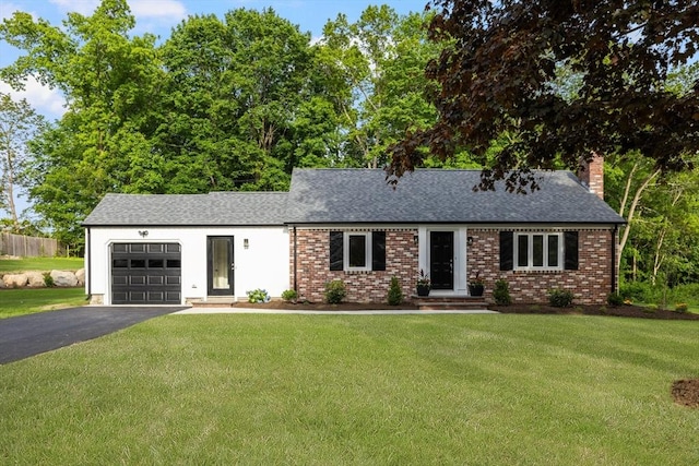 47 Jacob St, Seekonk, MA 02769 - view of front of home with an attached garage, driveway, brick siding, and a front yard