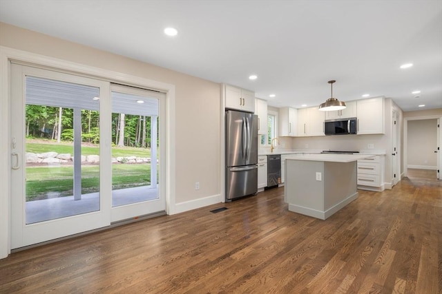 47 Jacob St, Seekonk, MA 02769 - kitchen with appliances with stainless steel finishes, light countertops, baseboards, recessed lighting, and dark wood-style flooring