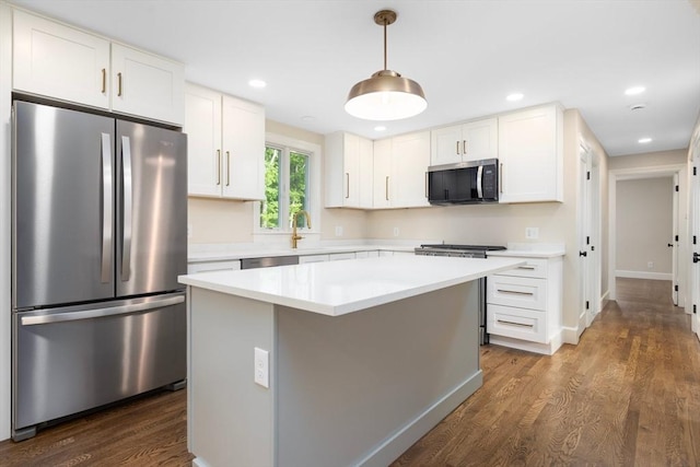 47 Jacob St, Seekonk, MA 02769 - kitchen featuring stainless steel appliances, dark wood finished floors, light countertops, white cabinets, and recessed lighting