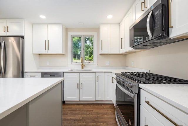 47 Jacob St, Seekonk, MA 02769 - kitchen featuring stainless steel appliances, a sink, dark wood finished floors, white cabinetry, and recessed lighting