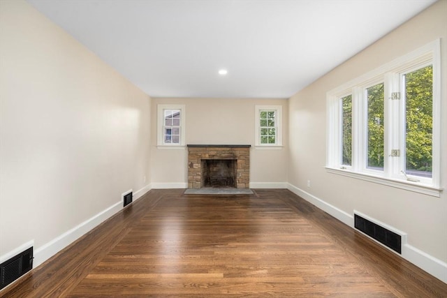 47 Jacob St, Seekonk, MA 02769 - unfurnished living room featuring baseboards, a stone fireplace, wood finished floors, and recessed lighting