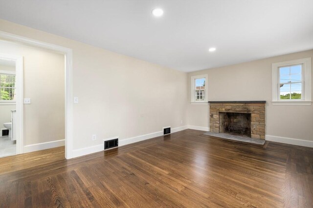 47 Jacob St, Seekonk, MA 02769 - unfurnished living room featuring a stone fireplace, baseboards, wood finished floors, and recessed lighting