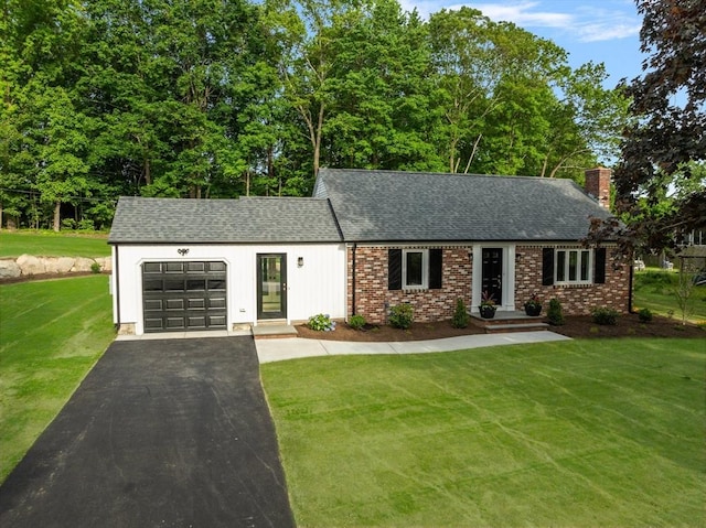 47 Jacob St, Seekonk, MA 02769 - view of front of house featuring a garage, asphalt driveway, a chimney, a shingled roof, and a front lawn