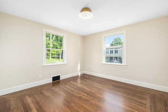 47 Jacob St, Seekonk, MA 02769 - spare room with healthy amount of natural light, baseboards, and dark wood-type flooring