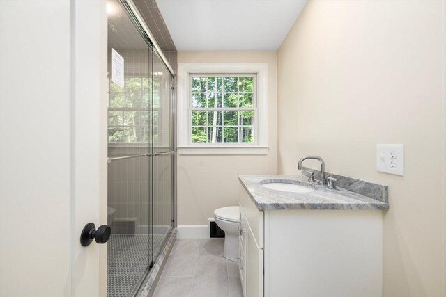 47 Jacob St, Seekonk, MA 02769 - full bathroom with toilet, vanity, a tile shower, baseboards, and tile patterned flooring