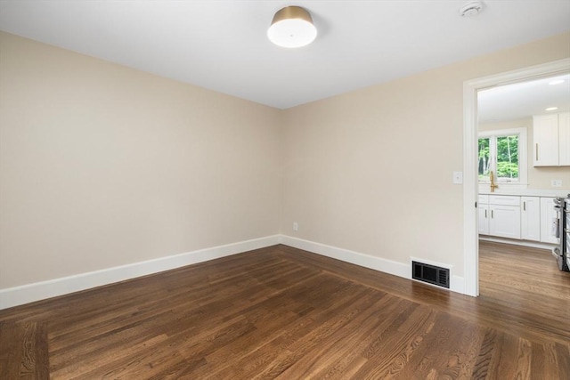 47 Jacob St, Seekonk, MA 02769 - unfurnished room with dark wood finished floors, baseboards, and a smoke detector