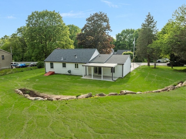 47 Jacob St, Seekonk, MA 02769 - back of house featuring a patio, a yard, and a shingled roof