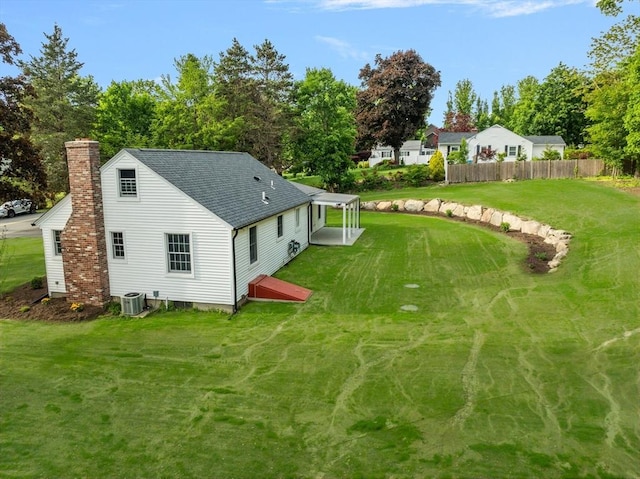 47 Jacob St, Seekonk, MA 02769 - rear view of property featuring a chimney, roof with shingles, cooling unit, and view of scattered trees