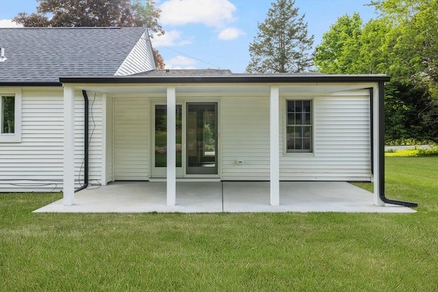 47 Jacob St, Seekonk, MA 02769 - rear view of house featuring a patio area, roof with shingles, and a yard