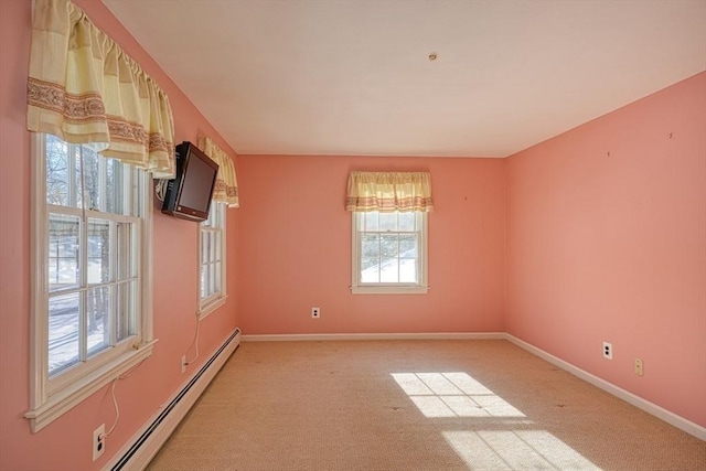 carpeted spare room featuring a baseboard radiator