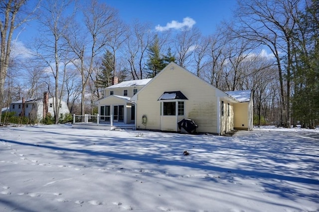 view of snow covered house