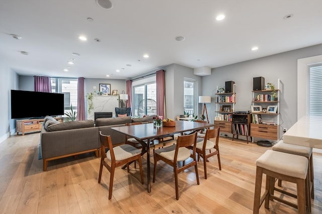 510 Dorchester Ave Unit 2R, Boston, MA 02127 - dining area with light wood-style flooring, plenty of natural light, recessed lighting, and a fireplace