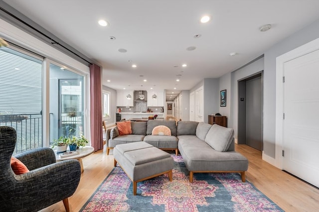 510 Dorchester Ave Unit 2R, Boston, MA 02127 - living room featuring recessed lighting, elevator, light wood-style floors, and baseboards