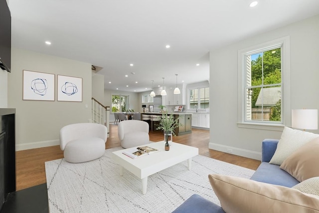 132 Hillside Ave Unit 132, Needham, MA 02494 - living room with light wood-style flooring, healthy amount of natural light, recessed lighting, and stairway