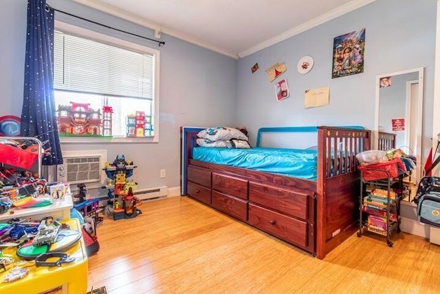 bedroom featuring a wall mounted air conditioner, ornamental molding, and light hardwood / wood-style flooring