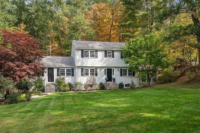 colonial home with a front lawn